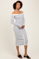 woman wearing a white and navy striped off-the-shoulder midi dress with long sleeves and button detailing