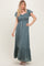 woman wearing a teal maxi dress with ruffled sleeves, smocked bodice, and front buttons
