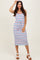 woman wearing a striped midi dress with red, white, and blue horizontal lines and a tied waist detail