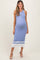 woman wearing a light blue ribbed maternity dress with buttons and white stripe details, showing her baby bump