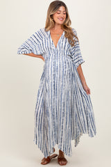 woman wearing a navy and white striped maternity maxi dress with a deep v-neck and flowing sleeves, showing her baby bump