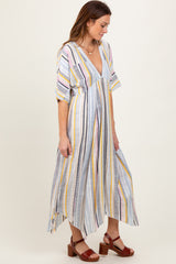 woman wearing a striped midi dress in pastel colors with a v-neckline and short belted sleeves