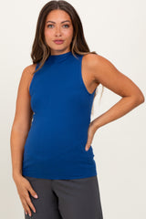 woman wearing a royal blue sleeveless maternity top with a high neckline and a fitted style
