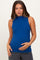 woman wearing a royal blue sleeveless maternity top and holding her baby bump