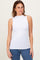 woman wearing a white sleeveless mock neck top and blue jeans
