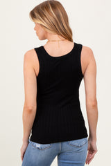 woman wearing a black ribbed maternity tank top, shown from the back with blue jeans