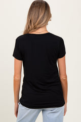 woman wearing a black short sleeve maternity top, viewed from the back