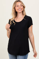woman wearing a black short sleeve t-shirt with a pocket and a rounded hem, smiling and posing
