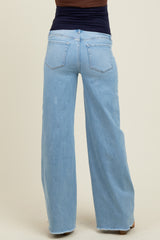 woman wearing light wash wide-leg maternity jeans, seen from the back