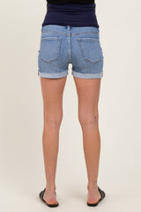 woman wearing light blue maternity denim shorts, viewed from the back, showing frayed hem and pockets