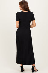 woman wearing a black ribbed maxi dress with short sleeves, shown from the back
