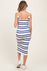 woman wearing a striped blue and white maternity dress with a fitted silhouette and a knee-length hem