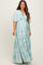 woman wearing a light blue floral maternity maxi dress with short sleeves and a tiered skirt, showcasing her baby bump