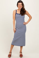 woman wearing a navy and white striped midi tank dress with a fitted silhouette and sandals