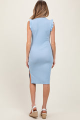 woman wearing a light blue sleeveless maternity dress with ruffled shoulders and a side slit, showcasing a baby bump