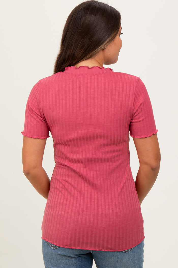 woman wearing a pink ribbed maternity top with short sleeves and a scalloped neck detail, showing the back view.