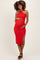 woman wearing a red halter neck maternity dress with a side slit and holding her baby bump