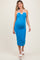 woman wearing a blue halter neck maternity dress with white trim and a visible baby bump