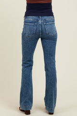 woman wearing blue maternity bootcut jeans seen from the back