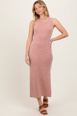 woman wearing a dusty rose sleeveless ribbed maxi dress and brown slide sandals