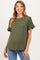 woman wearing an olive green short sleeve maternity top with ruffle details and a visible baby bump