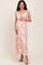woman wearing a pink floral maternity maxi dress with a tie-front detail and a visible baby bump