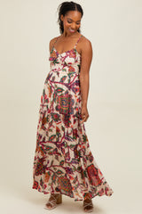 woman wearing a floral maxi dress with spaghetti straps and a flowing skirt