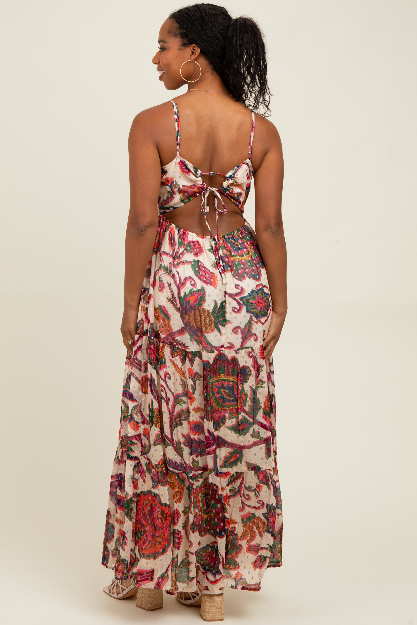 woman wearing a floral printed back tie crop top and matching long maxi skirt