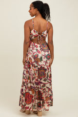 woman wearing a floral printed back tie crop top and matching long maxi skirt
