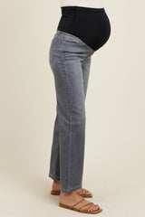woman wearing gray maternity jeans with a black over-the-bump waistband and visible baby bump