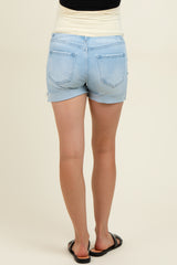 woman wearing light blue maternity denim shorts, showing a comfortable waistband and back pocket details