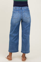 woman wearing light blue maternity wide-leg jeans, seen from the back