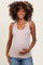 woman wearing a light brown maternity tank top and holding her baby bump
