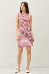 woman wearing a red and white striped sleeveless dress with a side knot detail