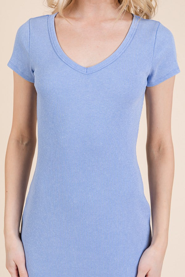 woman wearing a light blue short sleeve ribbed dress with a v-neckline