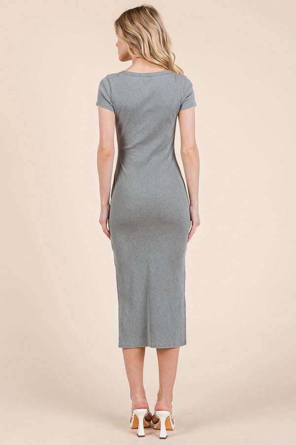 woman wearing a grey fitted midi dress with short sleeves, seen from the back