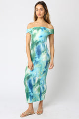 woman wearing a blue and green off-the-shoulder maxi dress with a fitted silhouette and a tie-dye pattern