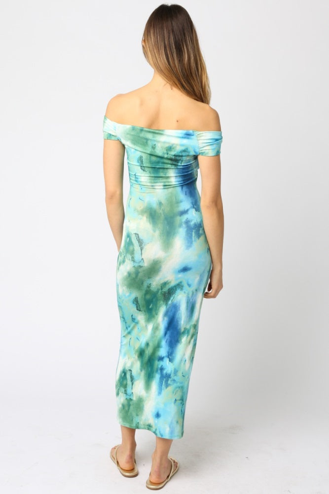 woman wearing a blue and green off-shoulder maxi dress with a fitted silhouette