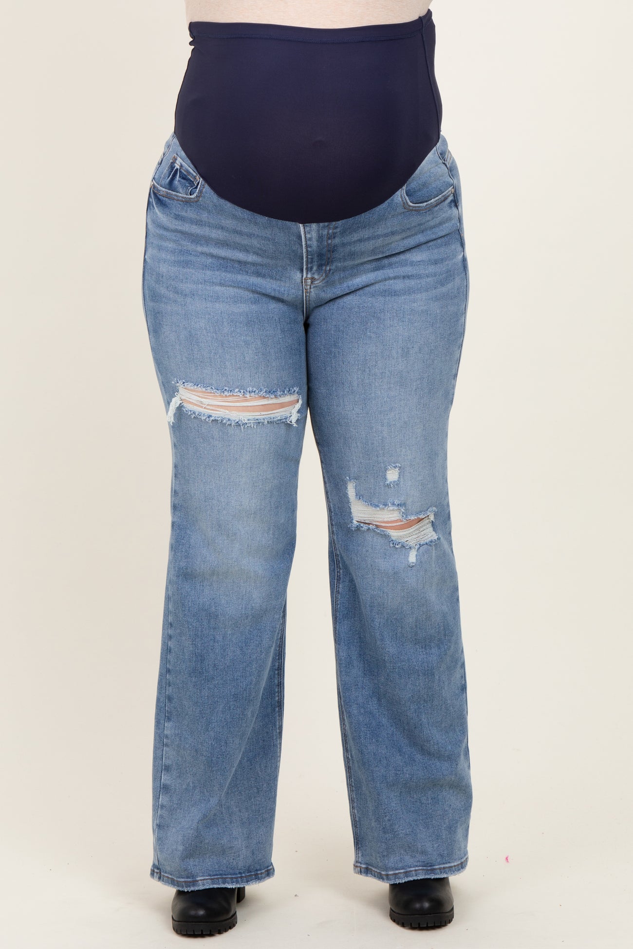 maternity plus distressed light blue jeans with a high waistband, featuring rips and a relaxed fit
