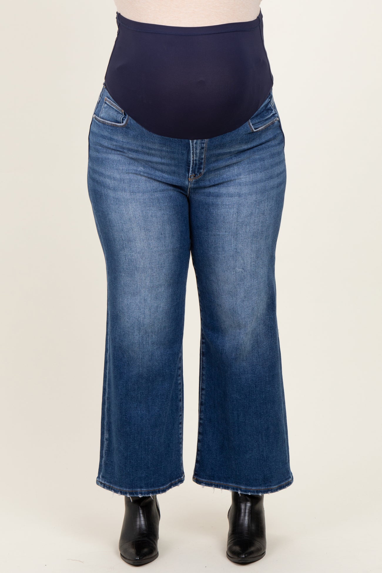 maternity wear plus size flared jeans with a dark blue over-the-bump waistband