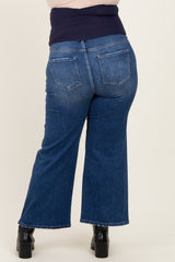 woman wearing maternity plus size dark wash flared jeans with a wide waistband, showing the back view
