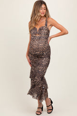 woman wearing a leopard print maternity dress with ruffled hem, displaying her baby bump