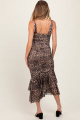 woman wearing a leopard print maternity dress with a tiered ruffle hem, showcasing a fitted silhouette from the back