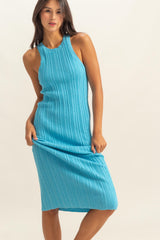 woman wearing a ribbed aqua blue midi dress with a sleeveless design and fitted silhouette