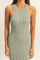 woman wearing a light green ribbed knit sleeveless dress