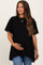 woman wearing a black short sleeve maternity top and holding her baby bump