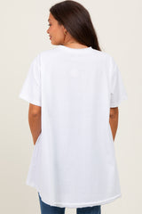 woman wearing a loose-fitting white maternity t-shirt, view from the back with a long curved hem