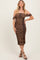 woman wearing a brown leopard print off-shoulder fitted midi dress with ruched details and strappy black heels