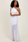 woman wearing a white one-shoulder ruched gown with a flared hem and a fitted bodice
