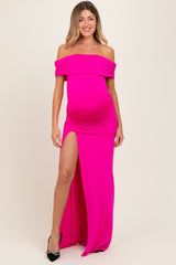 woman wearing a bright pink off-the-shoulder maternity gown with a thigh-high slit and a visible baby bump